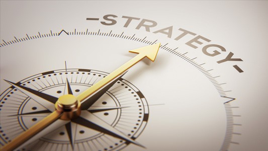 Compass needle pointing to strategy to indicate how important strategic planning is to marketing
